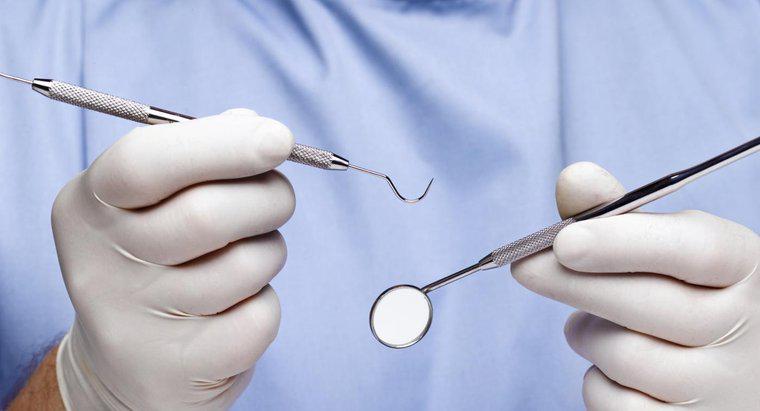 O que causa gengivas inchadas ao redor de um dente?